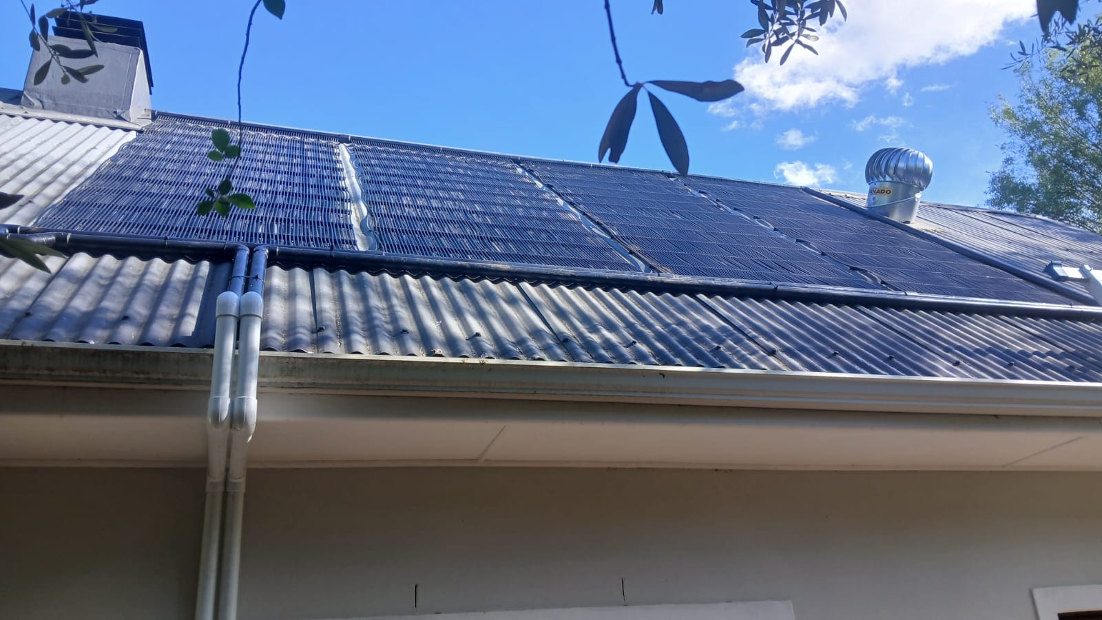 GridFree solar pool heating collectors fitted to a tiled roof